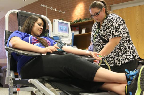 Senior Abby Velasquez donates blood during the fall blood drive in October.