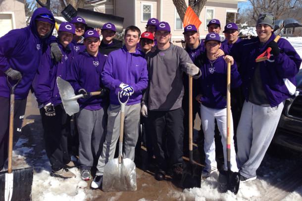 Baseball team members headed into the community to shovel snow for the elderly Tuesday, Feb. 26.