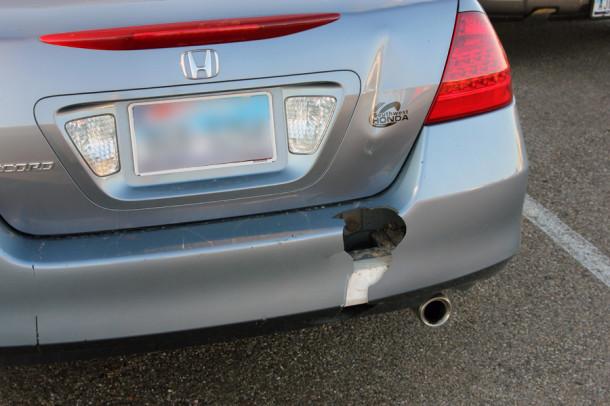 The car sports a gaping new hole in the rear bumper.
