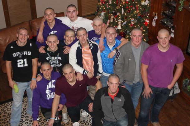 The boys basketball team gathered at senior Dylan Douglasss house Dec. 9 to shave their heads in support of head coach Guy Crenshaw. 