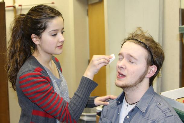 Sophomore Allison Koontz applies senior Josh Collins’ stage makeup for the 40-year-old character of Dub Dubberly.
