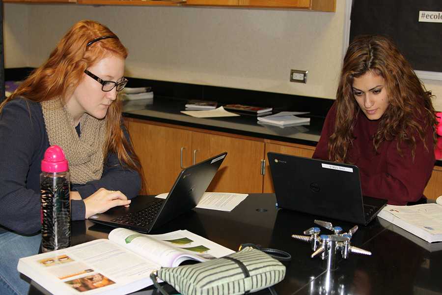 Seniors Keegan Fenton and Abby Franks use their Chromebooks in Biology. The science department received 250 Chromebooks this year.