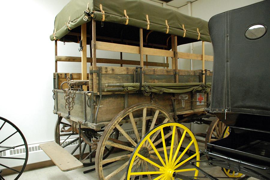 Seen in storage, the wagon manufactured by the Martin Truck and Body Corporation in York, Pennsylvania is a standard, United States Army field ambulance used during the years immediately preceding and during World War I (1917-1918). This example never was used overseas but is typical of field ambulances used there by the U.S. Army during World War I to transport sick and wounded persons to field hospitals behind the front. The Union Army utilized ambulances similar to this one during the Civil War and the frontier military used ambulances to haul passengers on the Southern Plains from the 1870s until the 1890s.
