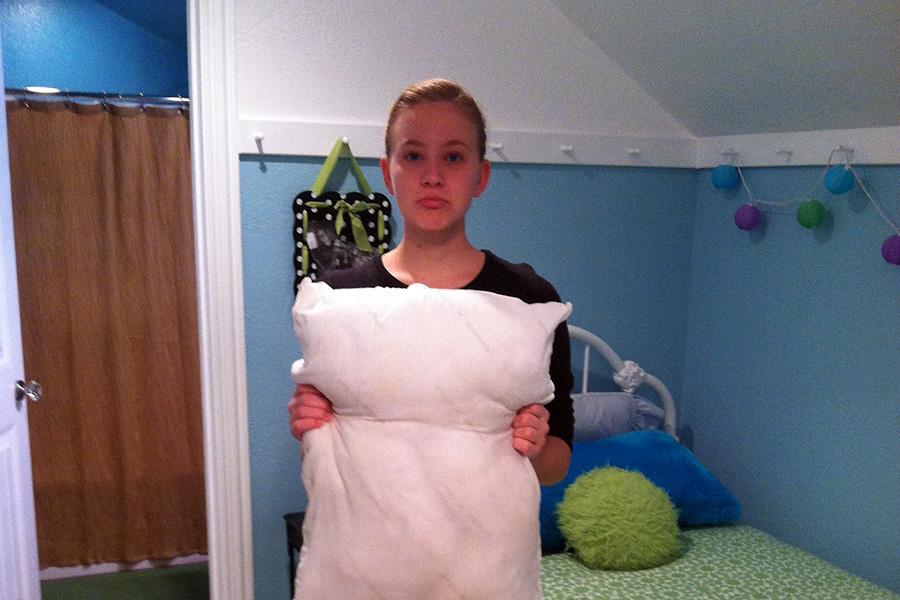 Tasha Brown holds the victim of the great pillow tragedy. 
