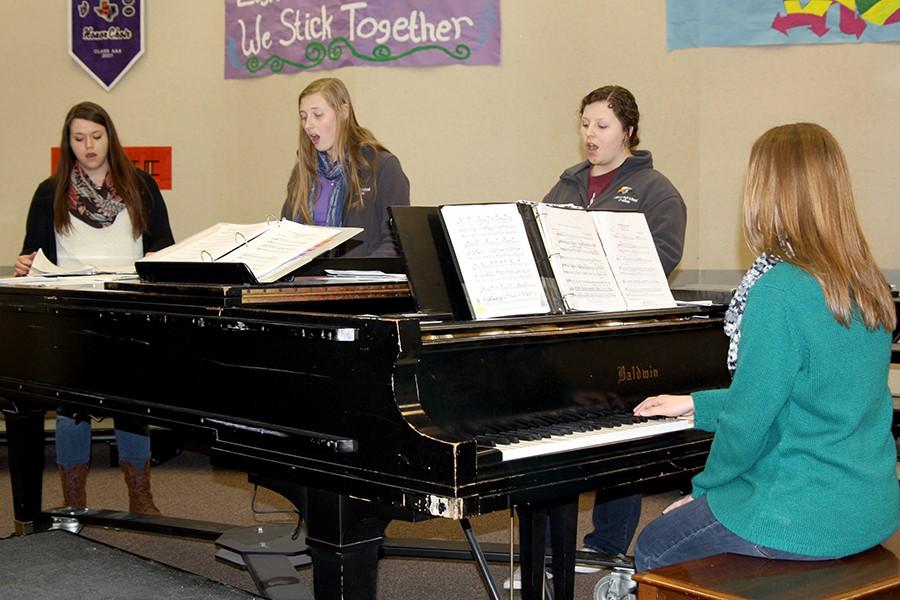 Seniors Hannah Williams (from left), Bailey DeBerry, Madison Younger and Hannah Dye practice the All-State music during activity period.