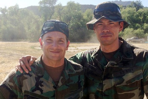 James Ryen stands with actor Bradley Cooper on the set  of American Sniper.