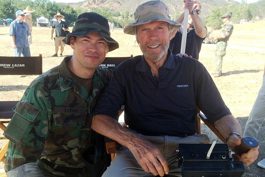 James Ryen sits with director Clint Eastwood on the set of American Sniper.