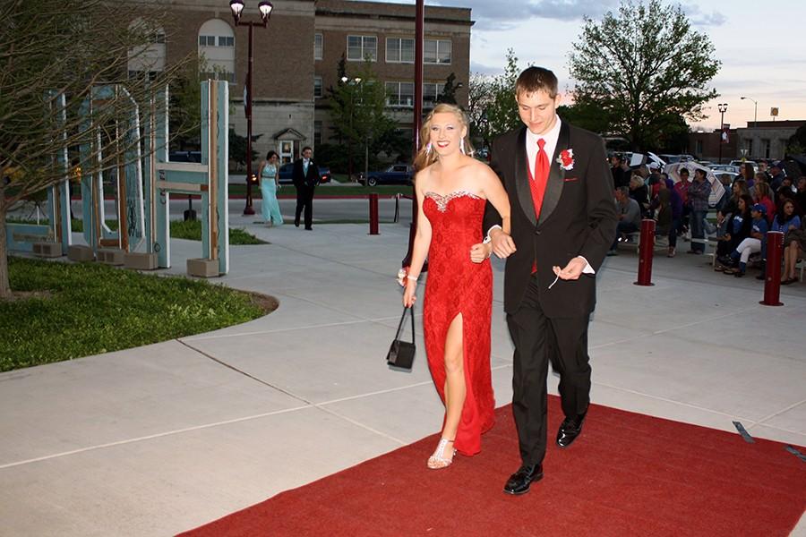 Senior Bailey DeBerry and 2014 graduate Blake Hartman walk the red carpet into Legacy Hall.