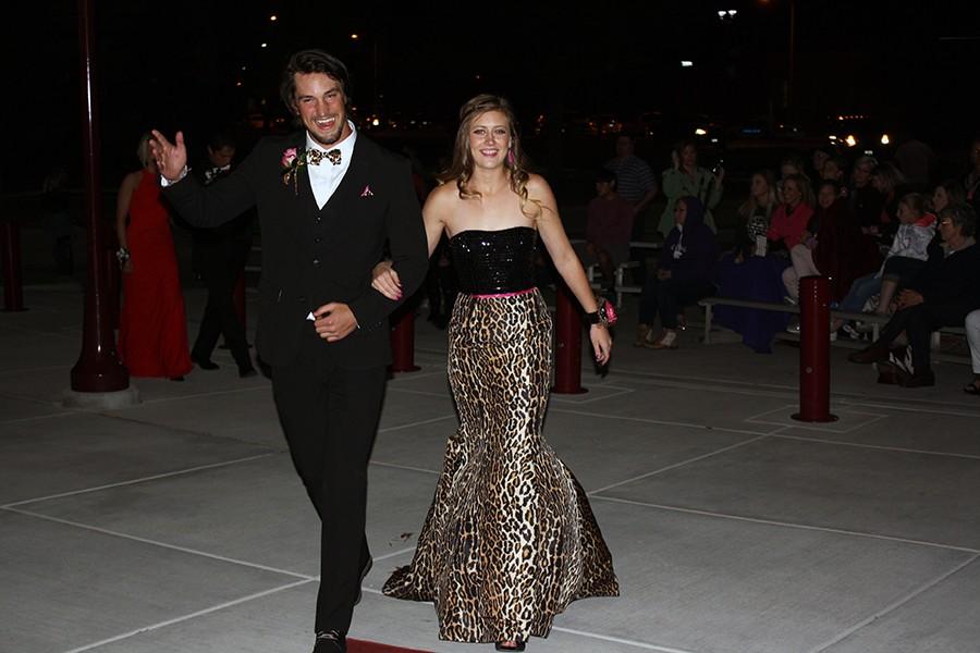 Seniors Isaac Garland and Kenidy Olson walk the red carpet before prom.