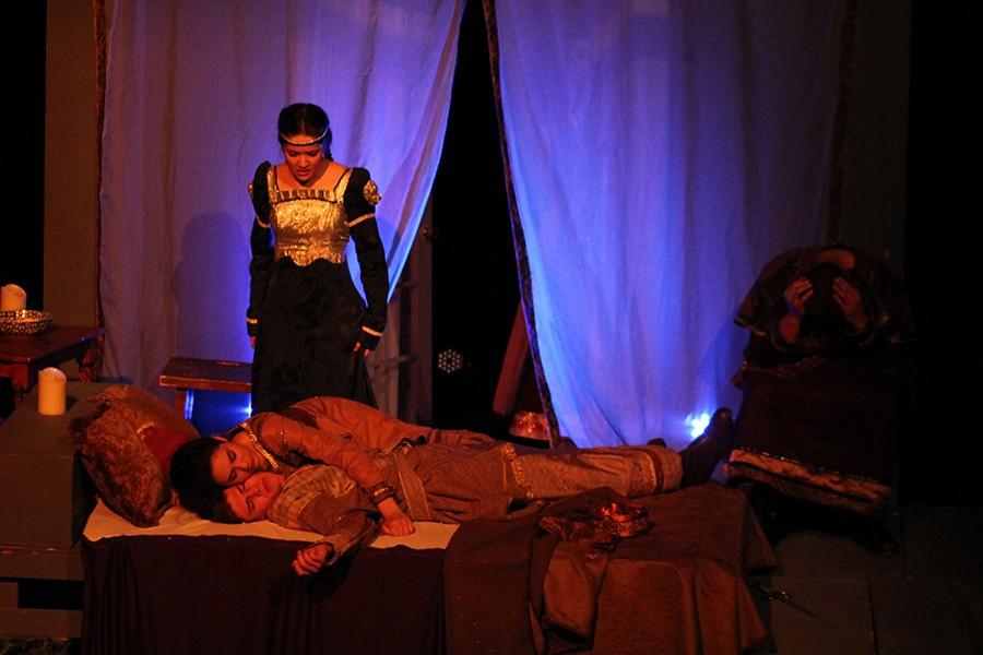 Junior Allison Koontz, acting as Antonia, looks down on her dead parents, played by senior Paige Stocton and sophomore Maverick Evans, during the play.