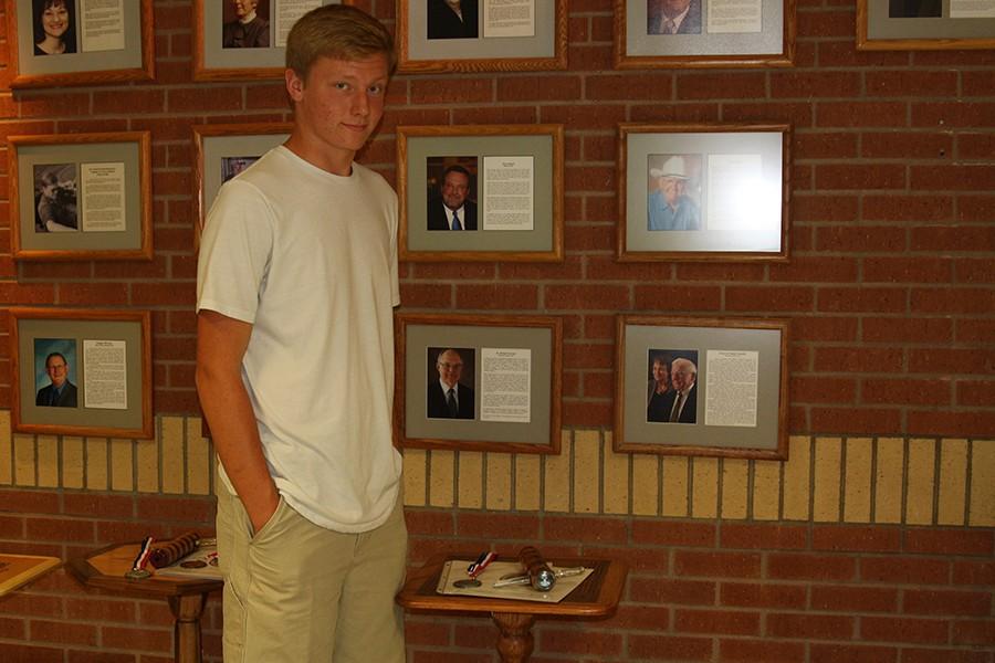 Freshman Bryson Blakewell stands with the project he created in class.