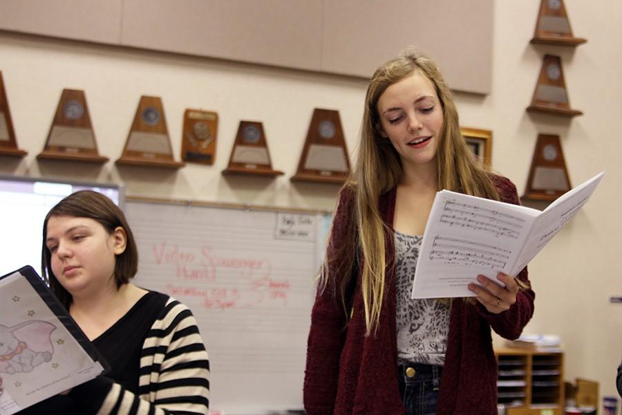 Juniors Maddie Farren and Chayse Armstrong practice their music during activity period. Both Farren and Armstrong were named to the All-District choir.
