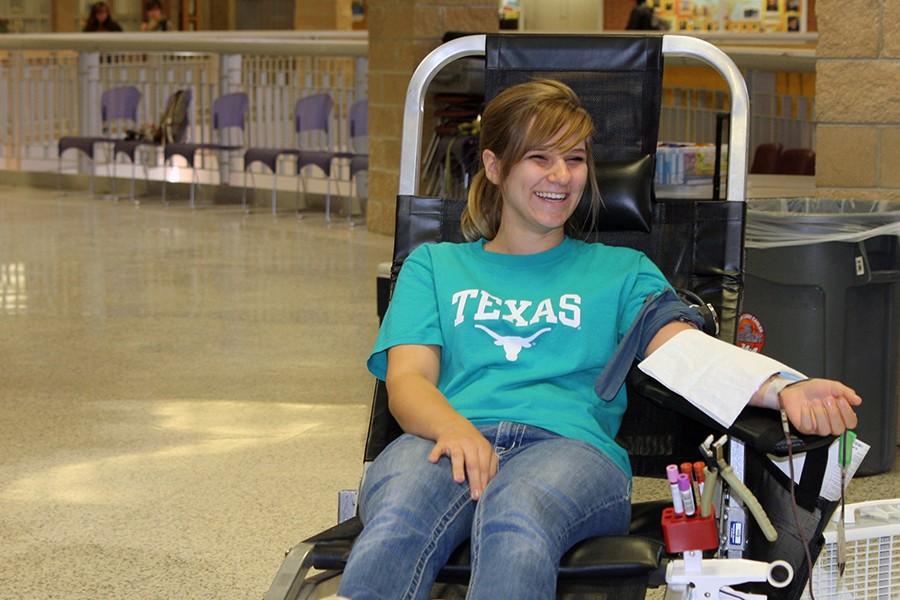 Graduate Jessica Blakeman donates blood at the 2014 fall blood drive.