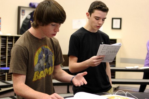 Freshmen Isaac Kizziar and Conner Nall practice their all-region music during activity period.