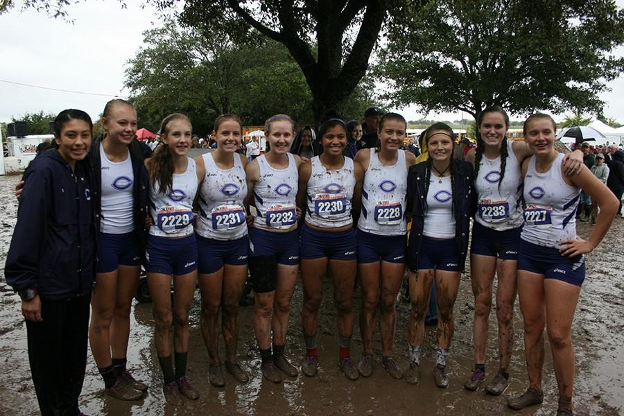 Mud covers the girls cross country team after their state race.