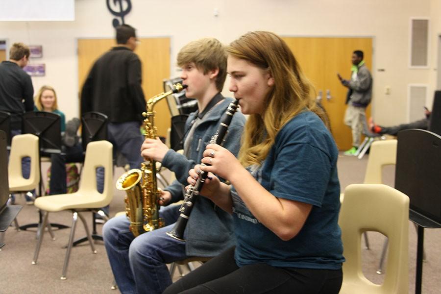 Senior Tesla Rowley and sophomore Braden Lefevre  rehearse to prepare for All-State band.