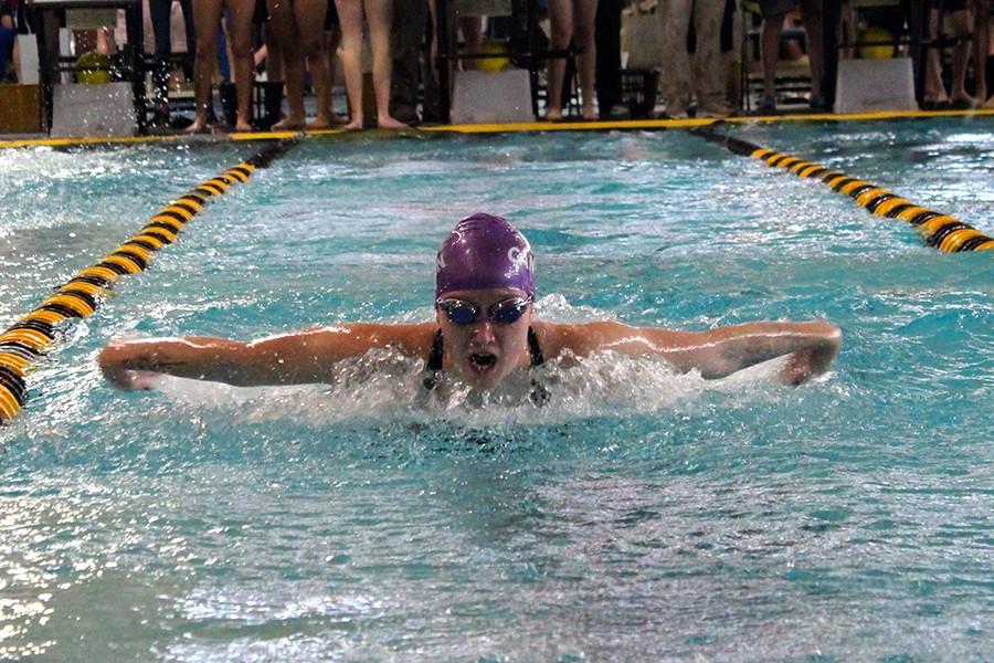 Senior Ally Brock competes in the butterfly stroke in Andrews.  I swam butterfly in the medley, probably the worst event of my life, Brock said.