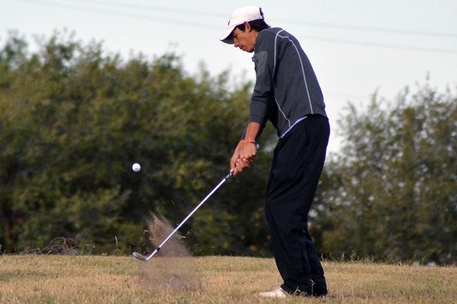 Senior Andrew Brewer chips the ball while playing at Phillips Municipal Golf Course in Borger.