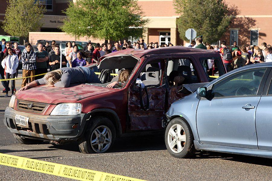 Students witness a mock wreck during the Every 15 Minutes program April 7.