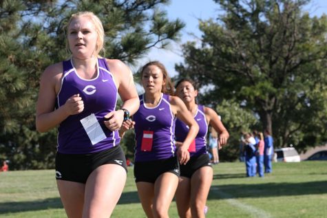 Seniors Micaela Cullender and Andrea Arellano and junior Jordan Garay compete in the meet at Thompson Park Sept. 10.
