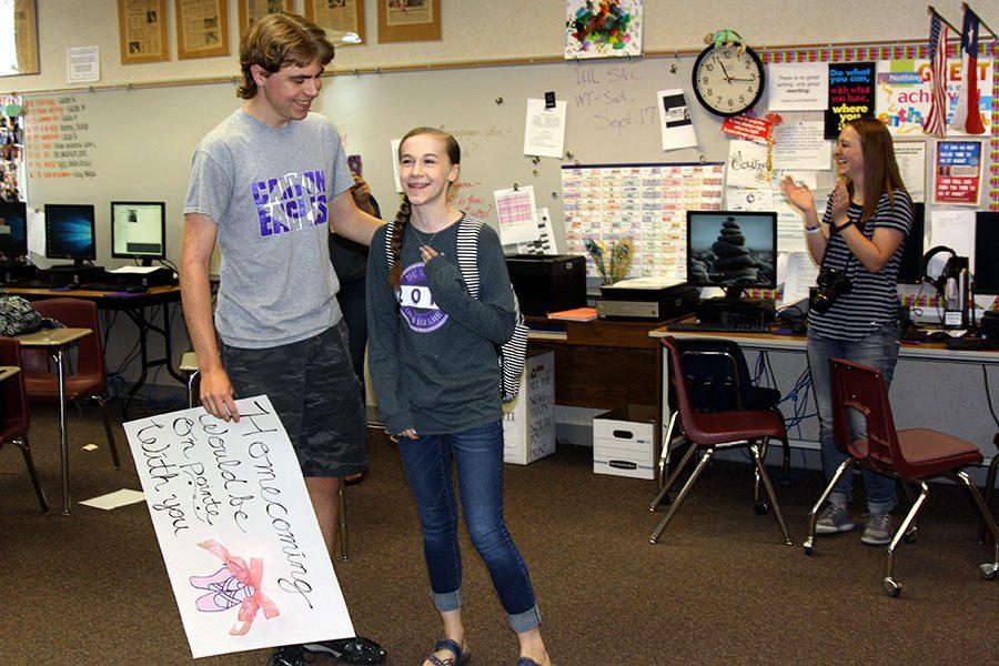 Newspaper video editor Jaren Tankersley asks yearbook staffer and ballerina Jillian Howell to homecoming with a ballet themed sign. (She said yes.)