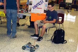 Sophomore Marshall Belcher demonstrates a robot during Club CHS.