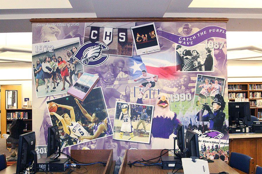 The north wall features photos in color from the 1970s through the 2010s of student life, athletics and band.
