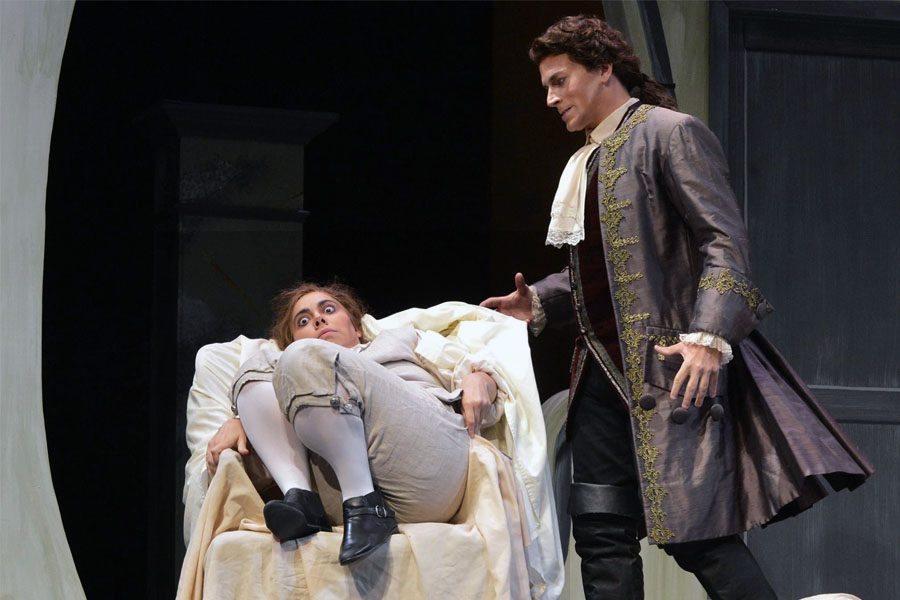 Count Almaviva, played by James Wright, finds Cherubino, played by Eliza Bonet, hiding under a blanket.