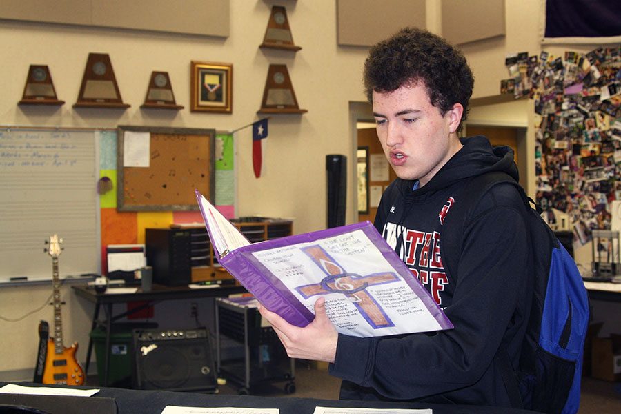 Junior Mitchell Hernandez rehearses in the choir room during activity period.