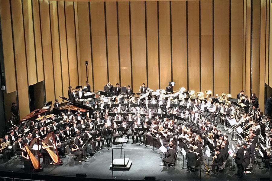 The 6A All-State Band prepares to perform in Lila Cockrell Theatre
