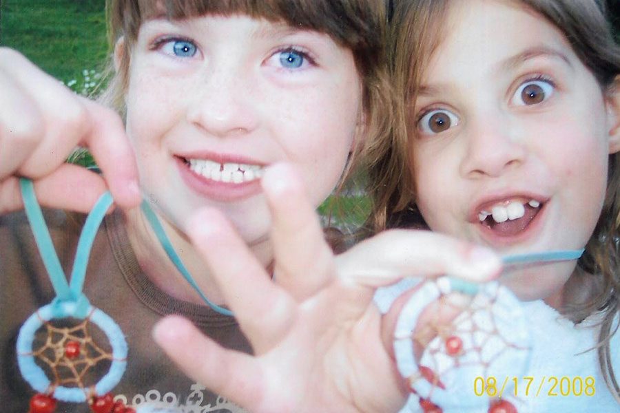 While on vacation together in Red River, New Mexico, 8-year-olds Sarah Gilliland and Lauren Allen show off their new dream catchers.