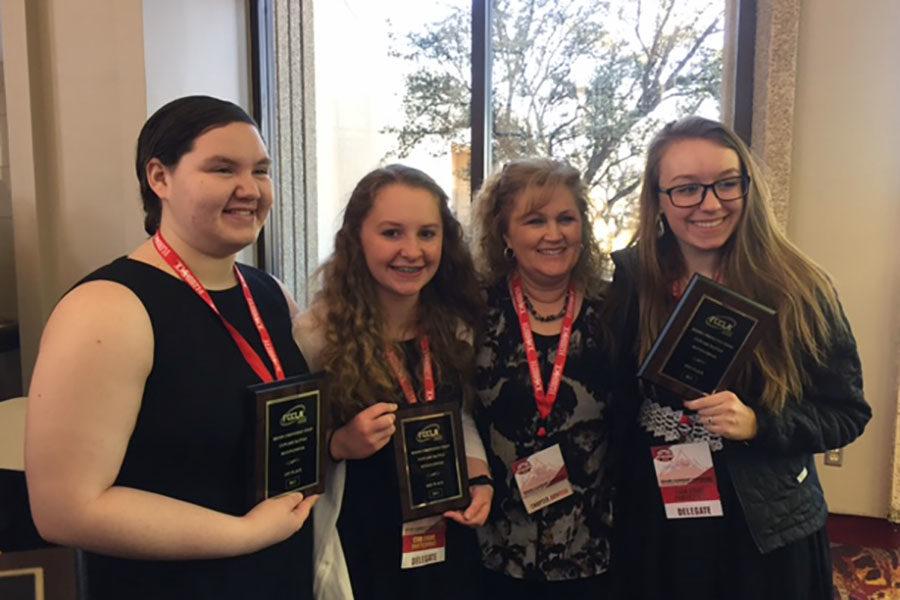Senior Rebecca Boehs, junior Emily Ray, culinary arts instructor Carrie-Anne Stanglin and Randall High School junior Katelyn Strobel receive their awards at the regional competition. 