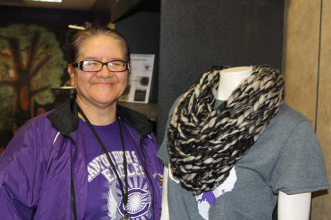 Martha Varela displays one of her handmade scarves on a mannequin in The Eagles Nest.