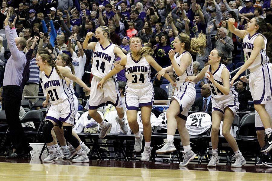 Assistant coach Kody Smith, junior Heather Davis, senior Maci King, junior Ayse Allison, seniors Codi Bradstreet and Faith Norman and sophomore Brylee Winfrey jump off the bench in celebration in the last seconds of the state championship game in San Antonio, March 4.