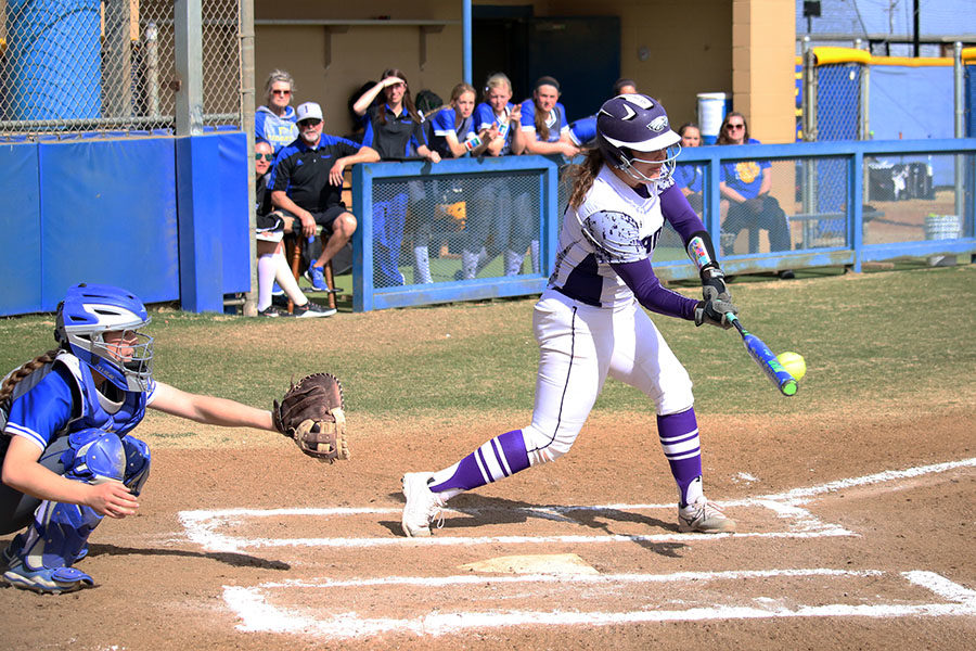 Senior Sarah Bell connects with a hit against Frenship in the Lubbock Tournament, Feb. 16-18.