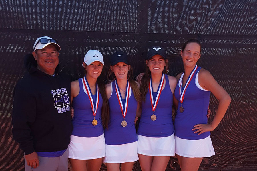 Head+tennis+coach+John+Gonzales+stands+alongside+seniors+Abi+Dillehay+and+Berkley+DeLong+and+juniors+Sarah+Gilliland+and+Shelbi+Braudt+after+the+district+competition.
