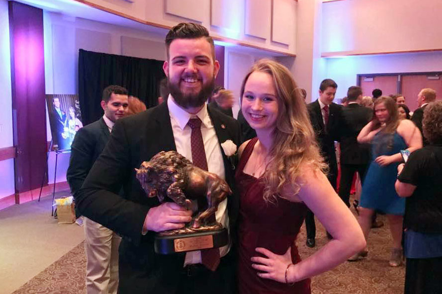 Myles Smith, with Hannah Yock, celebrates his WT Man of the Year Award.