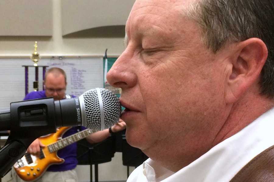 Director of school nutrition Ken Robinson sings Two Pump Texaco during a rehearsal.