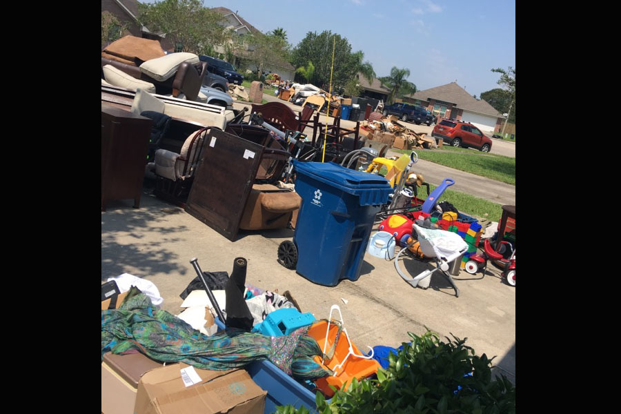 The Boswell family was forced to remove everything from their home for disposal after the flood receded. 
