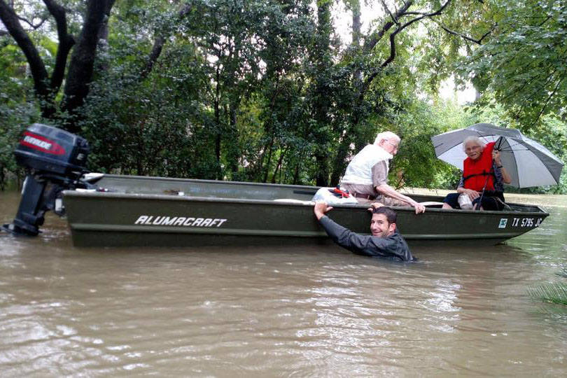 Dr. Lance McClintock rescues a couple who were stranded by flood waters.