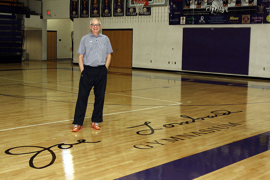 Coach Joe Lombard stands on his signature court at Canyon High School.