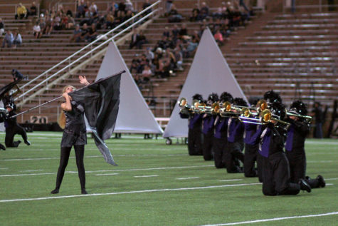 The Soaring Pride performed the first movement of their show, Uprising, at the football game against Amarillo High.