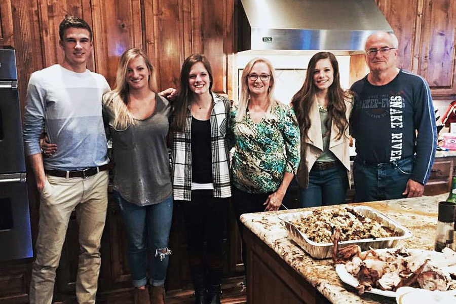 Norman, Katie, Whitney, Deedy, Mackenzie and Norman Grimes gather at a family Christmas dinner.