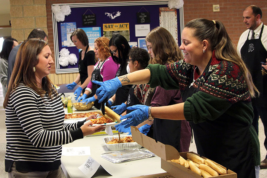 Randall High School teachers and students serve lunch to counselor Kelli Frock and other Canyon High faculty and staff.