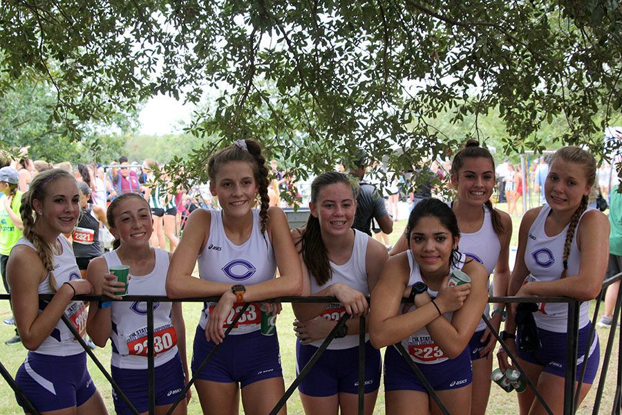 Still recovering from the race, the girls cross country team awaits results at the State UIL Cross Country Meet.