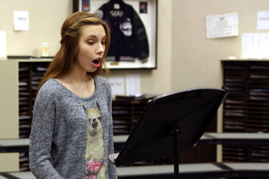 Junior Erin Sheffield practices in the choir room.