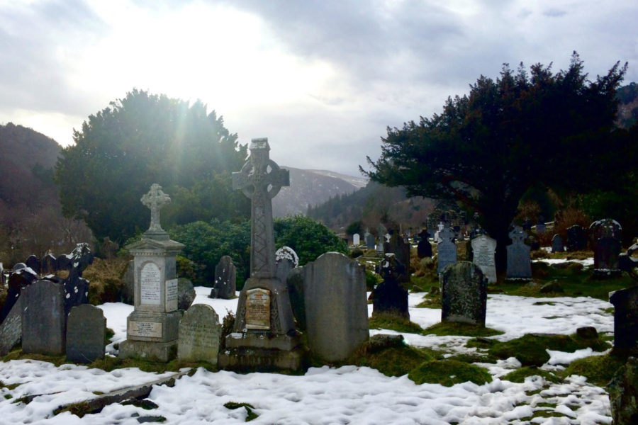 Sunlight shines on a graveyard near Laragh.