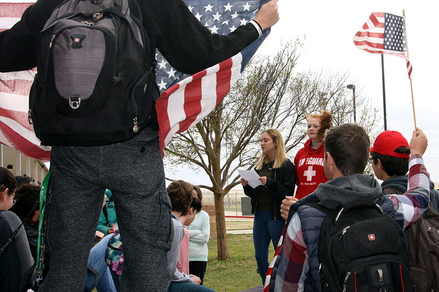 Counterprotestors held American flags to defend the Second Amendment.