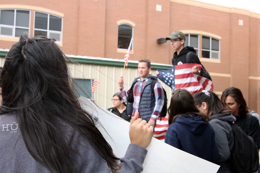 During the walkout, a group of students arrived with American flags to support the Second Amendment.