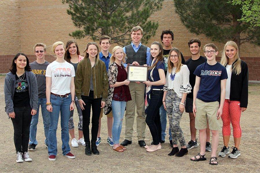 The 2018 staff of The Eagle's Tale celebrates with their National Scholastic Press Association Pacemaker Award.